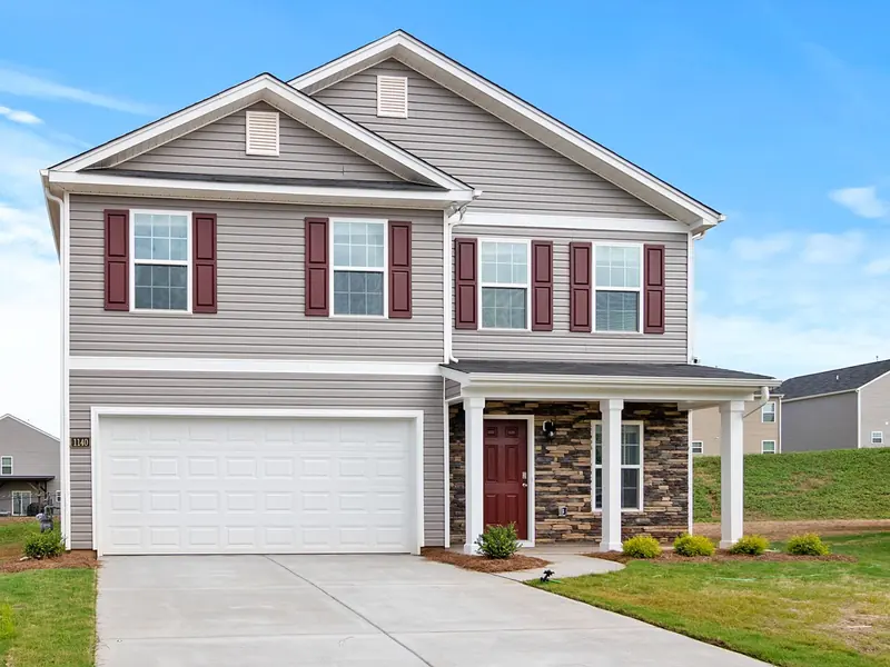 Two-story house with a front porch (example photo)