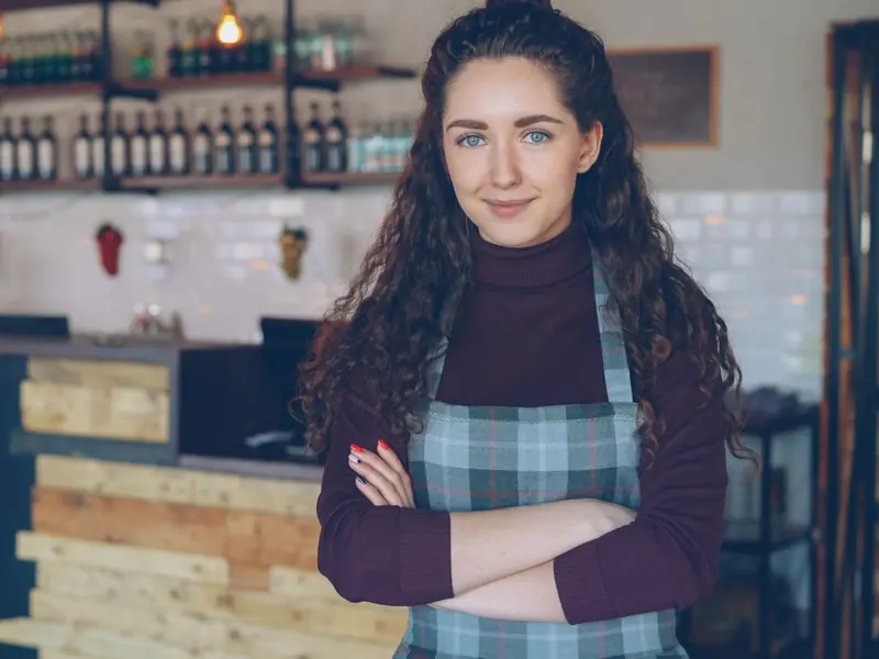 Café owner at the counter (example photo)
